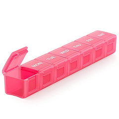 a pink plastic pill box with text: 'MON TUE WED THU'