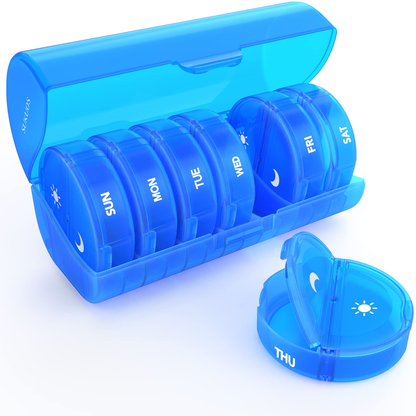 a blue pill box with a plastic container with text: 'SUKUOS SUN MON TUE THU WED FRI SAT'