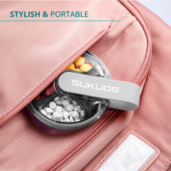 a container of pills in a pink bag with text: 'STYLISH & PORTABLE SUKUOS'