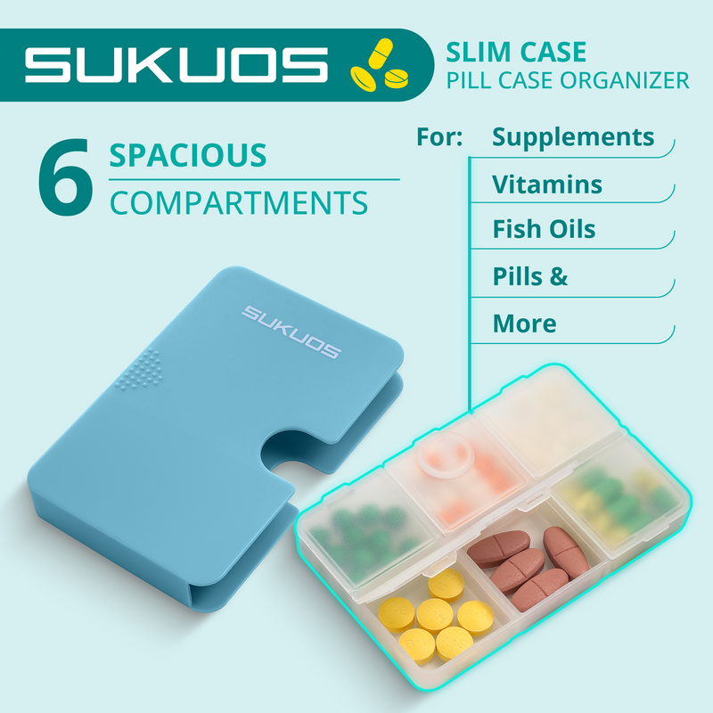 a blue pill box with different pills in it with text: 'SUKUOS SLIM CASE PILL CASE ORGANIZER 6 SPACIOUS For: Supplements COMPARTMENTS Vitamins Fish Oils Pills & SUKUOS More'