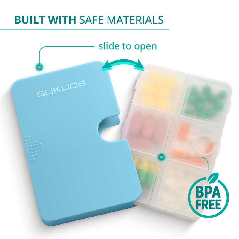 a blue pill box with a jigsaw puzzle piece with text: 'BUILT WITH SAFE MATERIALS slide to open SUKUOS BPA FREE'